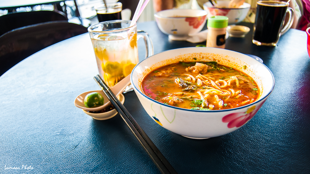 A bowl of Spicy Laksa Noodle Soup, a local favorite, it's spicy, creamy, and aromatic, it will give you a good sweat after, feel surpricingly good in the hot temparature. Location: Kota Kinabalu, Sabah, Malaysia
